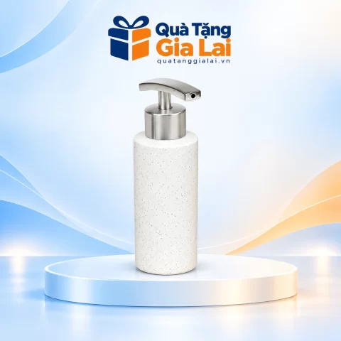 Bình dầu gội trụ tròn men sáng lấm tấm, vòi inox đầu nhấn bản rộng trên nền Quà Tặng Gia Lai