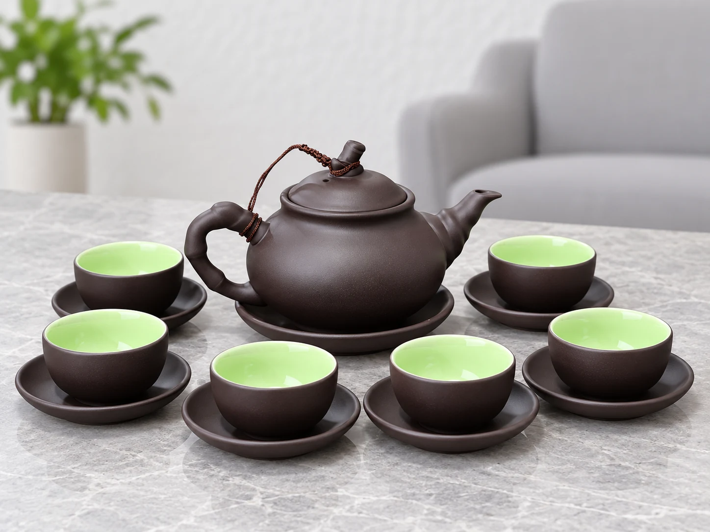 Bộ trà tử sa 14 bày một ấm, sáu chén và bảy đĩa trên bàn tiếp khách