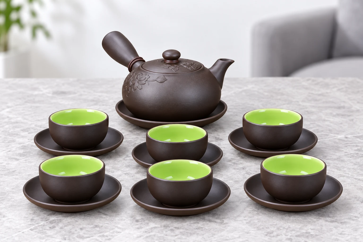 Bộ trà quai chuôi với đủ sáu chén lòng xanh trên bàn tiếp khách