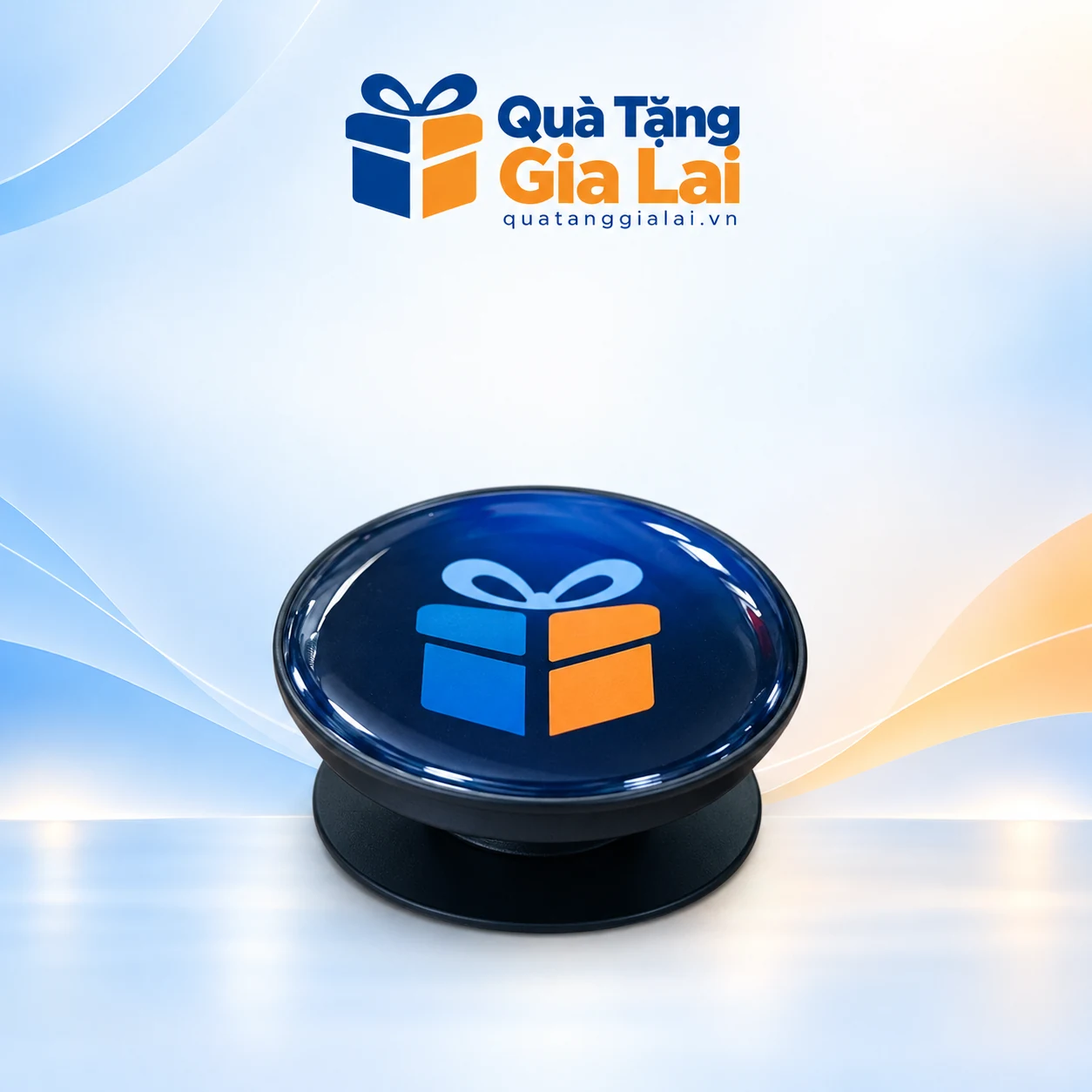 Giá đỡ điện thoại mặt tròn xanh đậm có biểu trưng xanh cam và đế đen
