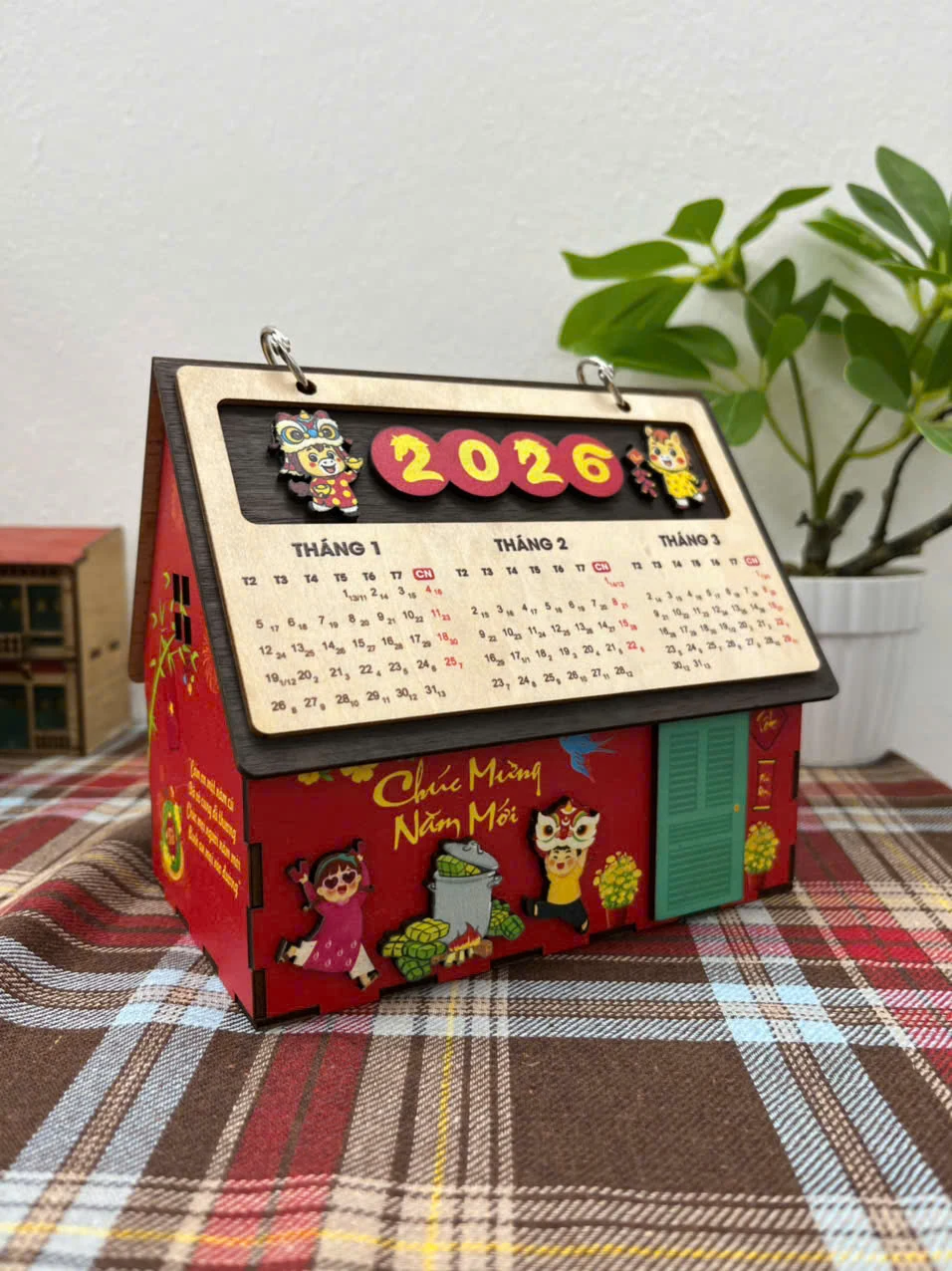 Lịch ngôi nhà đỏ với hình múa lân